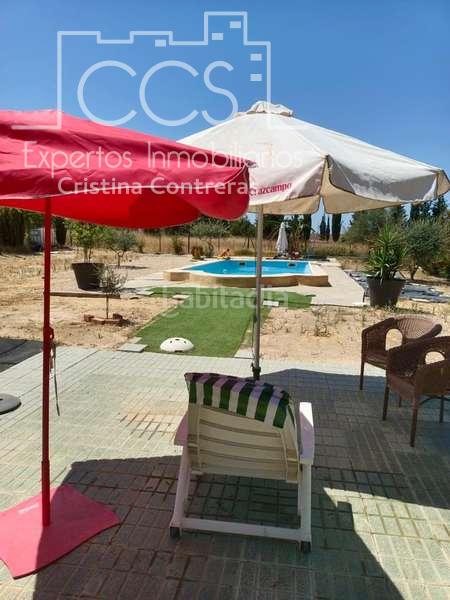 Foto 31217dda-ca5a-43aa-9d0e-2062a6f539df. Masía venta de finca de 12.285 m2 de terreno con casa de madera de 85m2 construidos en rociana, huelva en Rociana del Condado