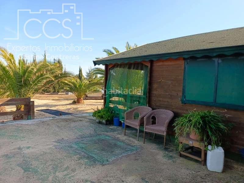 Foto 6dd4c404-721a-460d-99fc-64d41d05e757. Masía venta de finca de 12.285 m2 de terreno con casa de madera de 85m2 construidos en rociana, huelva en Rociana del Condado