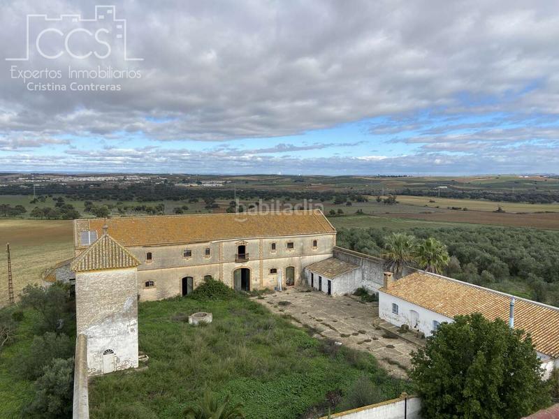 Foto e88ec804-91eb-4c46-b1f6-b0ce84247a49. Masía venta de finca de 4.236 m2 de terreno con 4 construcciones en total de 950,75 m2 en sevilla en Huévar