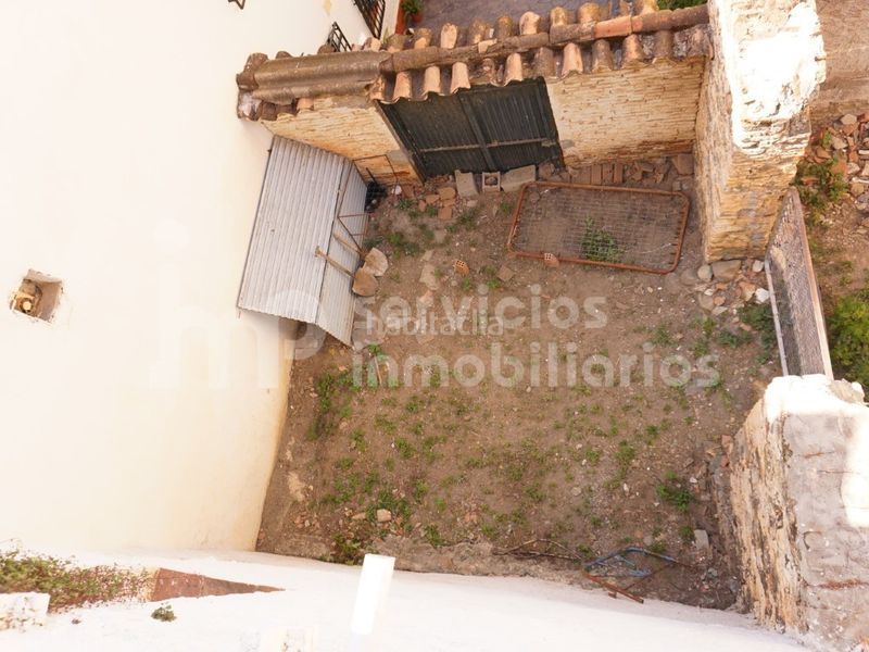 Foto b7215d0b-14d5-4b2f-b049-61bd0c69cfb3. Casa adossada a Benamocarra