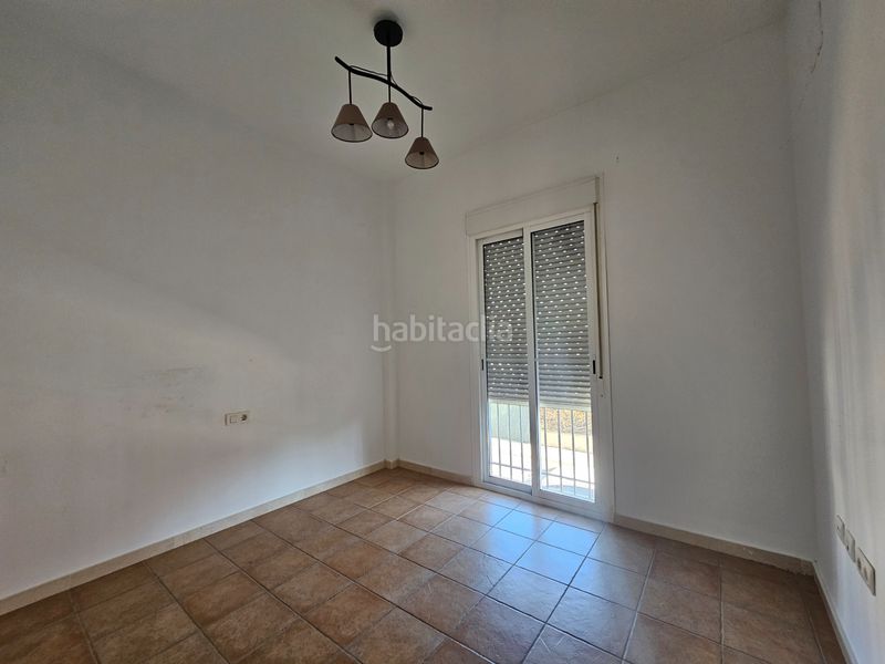 Foto 7f113bee-f459-4677-94ca-3a778d761138. Casa aparellada amb xemeneia aparcament piscina a Umbrete