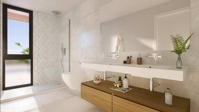 Foto f8625c9b-6c9e-49ac-8567-2e5013df81a8. Casa adosada obra nueva espectaculares adosados 4 habitaciones piscina garage vistas al mar en Mijas