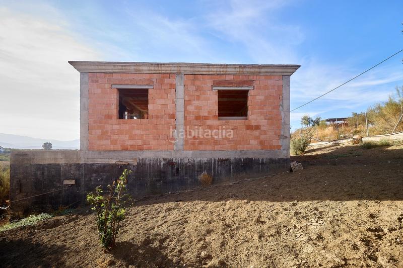 Foto 06ed3105-f44c-498f-a764-efef5199a517. Finca rústica terreno rústico de 3.750 metros, con casa de apero, olivares y edificación sin terminar. en Coín
