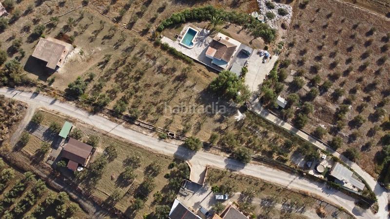 Foto 122275cf-4205-43b0-a48f-588efaad963a. Finca rústica terreno rústico de 3.750 metros, con casa de apero, olivares y edificación sin terminar. en Coín