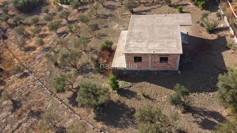 Foto 335b9b94-2962-47ea-a1e2-e34e0e27c353. Finca rústica terreno rústico de 3.750 metros, con casa de apero, olivares y edificación sin terminar. en Coín