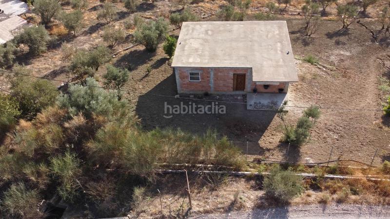 Foto 391944b5-71b6-4e2e-9b06-bf1e78cd9989. Finca rústica terreno rústico de 3.750 metros, con casa de apero, olivares y edificación sin terminar. en Coín