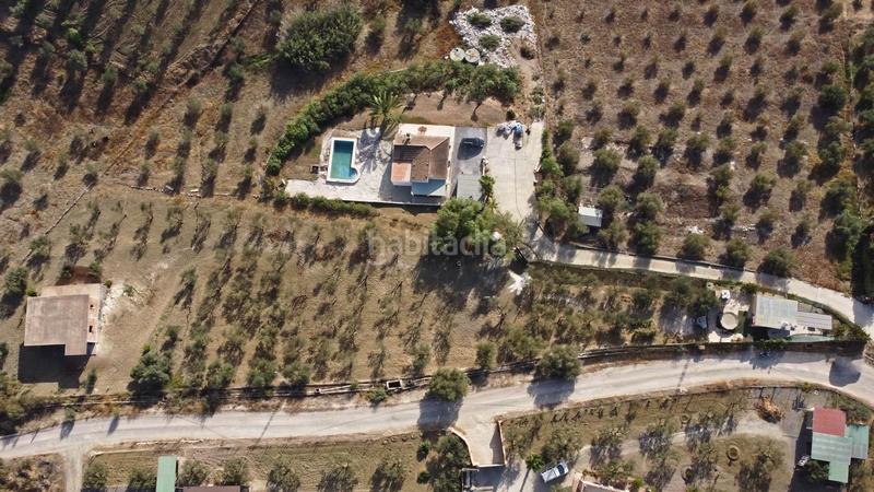 Foto 3ef2fe13-6305-4e15-9720-5c4a9ecfce0a. Finca rústica terreno rústico de 3.750 metros, con casa de apero, olivares y edificación sin terminar. en Coín