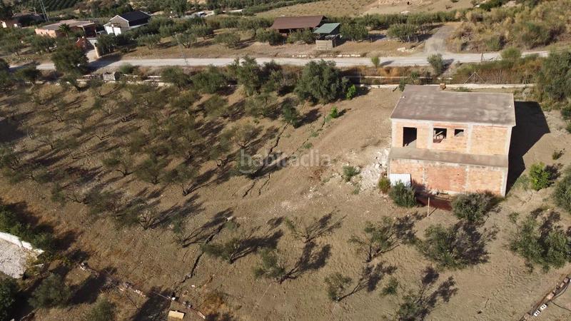 Foto 7e6838bb-bdb8-4245-81a9-672569f50005. Finca rústica terreno rústico de 3.750 metros, con casa de apero, olivares y edificación sin terminar. en Coín