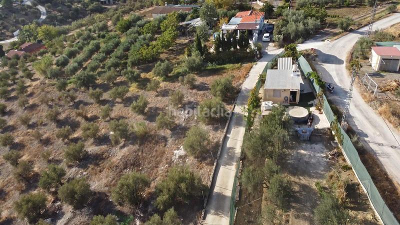 Foto 84d12e19-0adf-4eb2-b9b7-38ffc3bdb08d. Finca rústica terreno rústico de 3.750 metros, con casa de apero, olivares y edificación sin terminar. en Coín