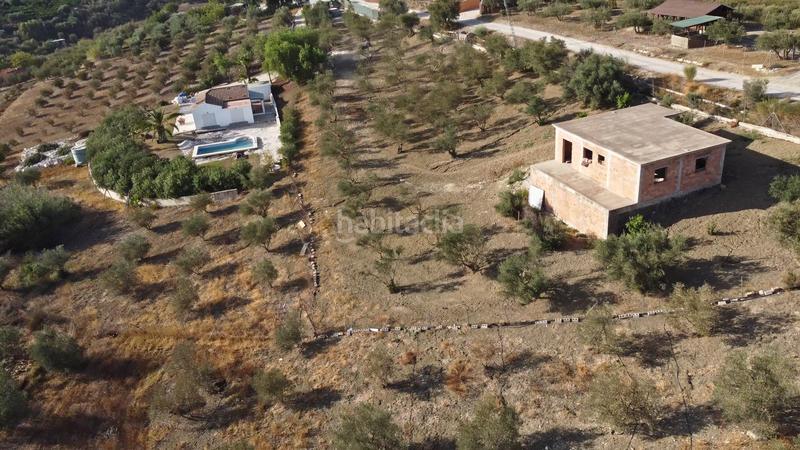 Foto a05578d5-2402-4628-b605-201a62e76e1f. Finca rústica terreno rústico de 3.750 metros, con casa de apero, olivares y edificación sin terminar. en Coín
