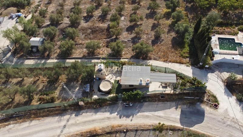 Foto bf617a8f-0fbf-4944-95ec-81a075a99070. Finca rústica terreno rústico de 3.750 metros, con casa de apero, olivares y edificación sin terminar. en Coín