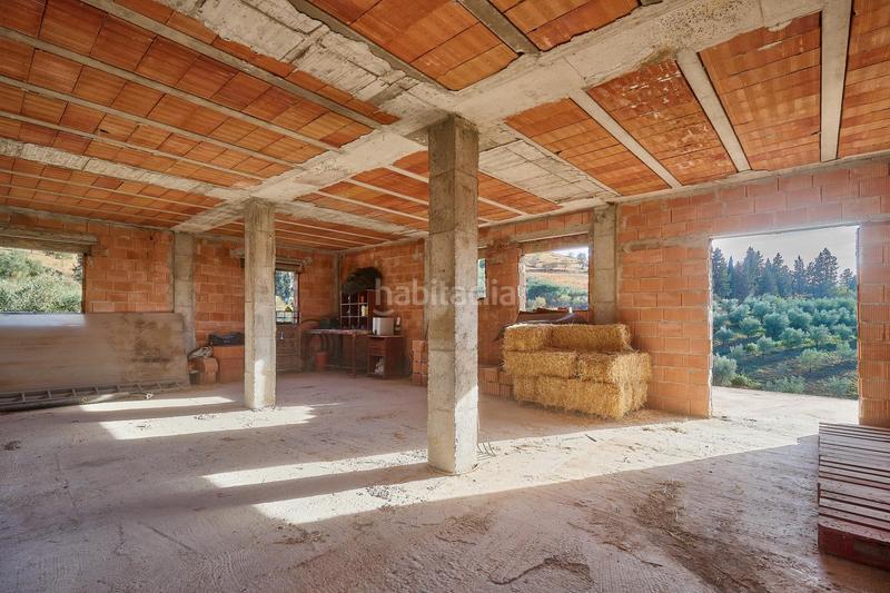 Foto f29cc20f-ee59-412d-a414-6db59666a1ea. Finca rústica terreno rústico de 3.750 metros, con casa de apero, olivares y edificación sin terminar. en Coín