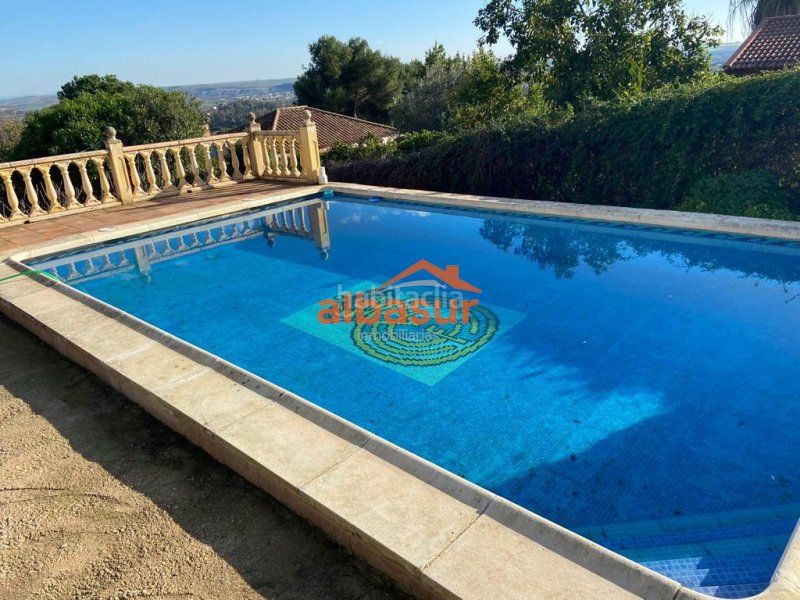 Foto 9760a2da-3a6e-4128-acbc-98bf52f6ecf1. Masia amb xemeneia calefacció piscina a Almodóvar del Río