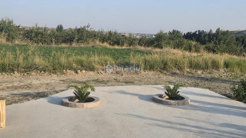 Foto 4c63ccd2-53f3-42a3-b97f-840eb21712f8. Estudio se vende finca con casita a estrenar en el barrio de la cruz, con un ambiente de espacios amplios y en el campo rodea en Castilléjar