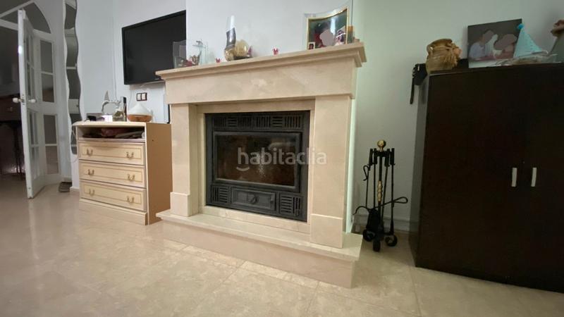 Foto bf3eb27e-fcc3-439f-8a09-365d9b70f3ce. Casa a schiera con camino in Torreblanca Sevilla