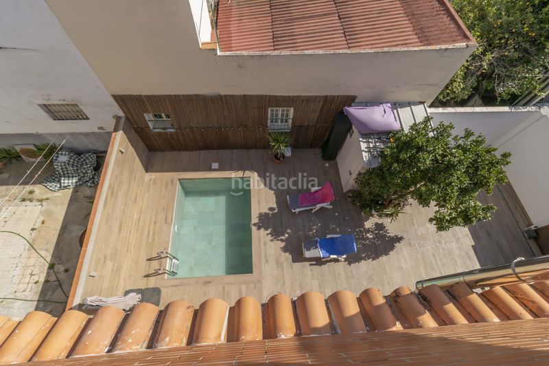Foto 5594fb71-d16c-4ebf-a7f7-622059ffa633. Casa aparellada amb aparcament piscina a Ciudad Jardín Sevilla