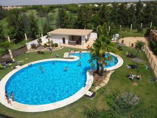 Lloguer Pis a El Portil. Urbanizcion con piscina