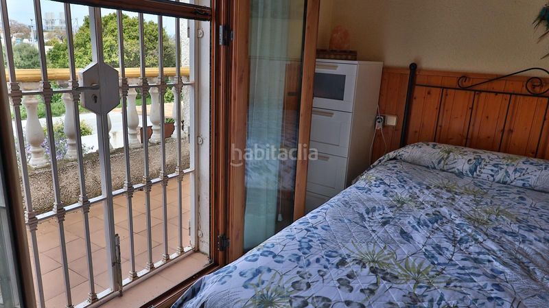 Foto 4db820d4-8c1b-4fda-989f-64065c5f0e48. Casa aparellada amb aparcament piscina a Guadalmar Málaga