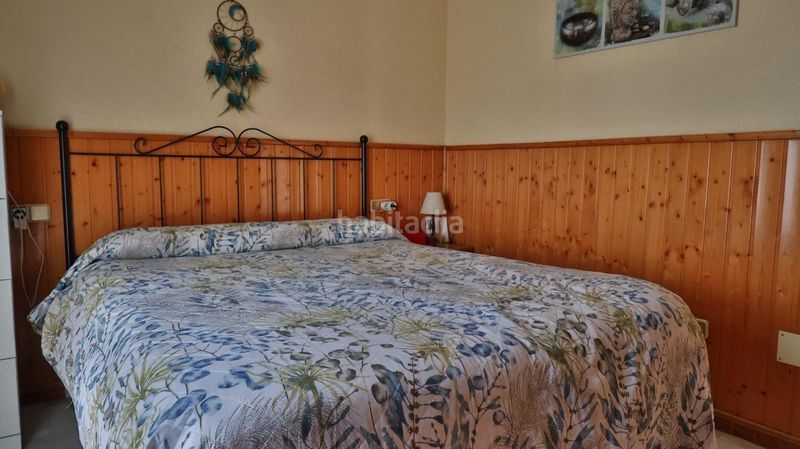 Foto c5c6b3c9-fc9e-4cfe-8ba8-75ef7b50a749. Casa aparellada amb aparcament piscina a Guadalmar Málaga