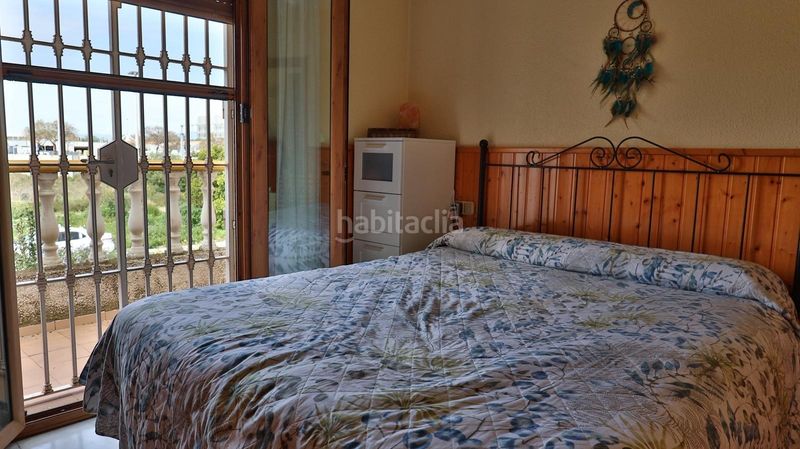 Foto ee15f3b9-1d25-44c3-84e3-488af2a84b95. Casa aparellada amb aparcament piscina a Guadalmar Málaga