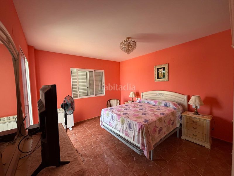 Foto 19620945-d999-4849-8833-a53099044439. Casa aparellada amb aparcament a Polinyà de Xúquer