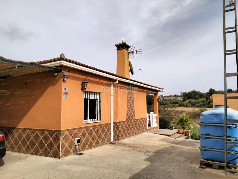 Foto c5de932e-62b2-4b55-8070-0ff2459f856e. Masia amb xemeneia calefacció aparcament piscina a Cártama