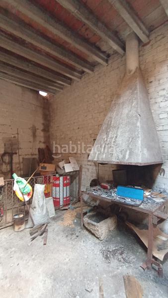 Foto ae8ec740-c5c7-46d0-9686-8ad8d88dddca. Casa  de pueblo con gran almacén en la parte alta en Camarasa