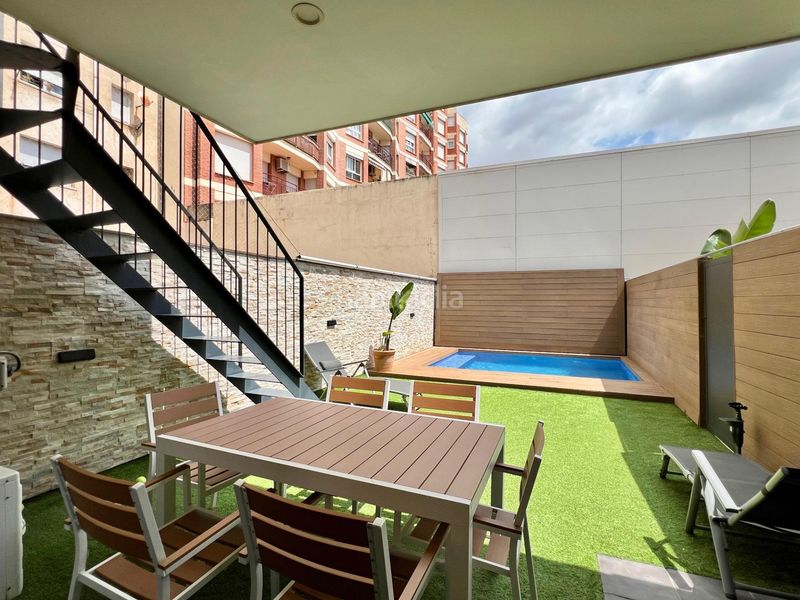 Foto 1ceb1f80-8cef-410e-86a7-aae7f622c727. Casa amb calefacció aparcament piscina a Eixample Sabadell