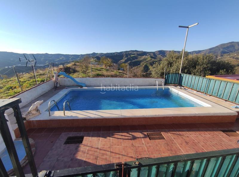 Foto 9aaabab6-0c59-43cb-ba37-c00c734c2e93. Masia amb piscina a Cútar