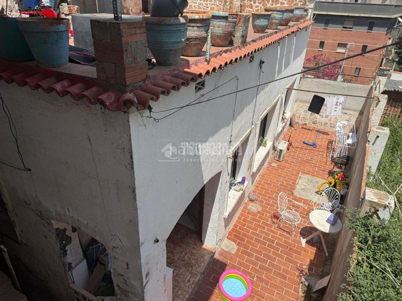 Foto 6b5c320f-4b15-47c5-8111-d7c4ede41184. Casa aparellada a El Raval Santa Coloma de Gramenet