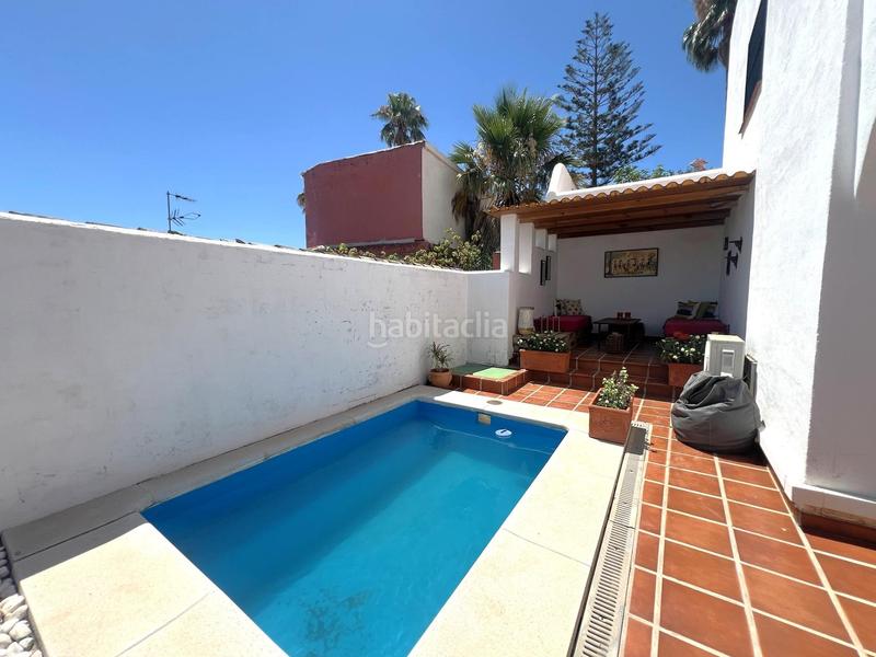 Foto e4312e74-c810-4a10-bc32-597e93d80ebb. Casa aparellada amb aparcament piscina a Torreblanca del Sol Fuengirola