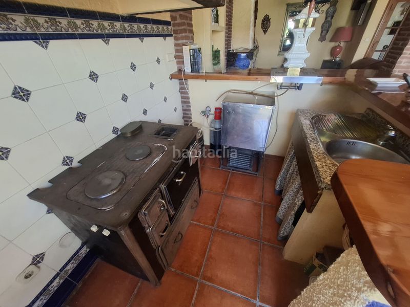 Foto ef1f7b6a-0f08-47b1-98d6-8496655b5e76. Casa adossada amb xemeneia calefacció aparcament piscina a Jaén