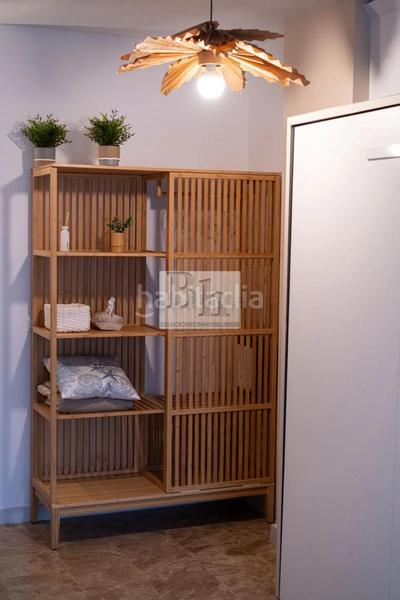 Foto 64b7cd33-4c5f-41fa-8b25-f61987ad608e. Estudio blanhogar vende estudio con plaza de garaje y licencia turística en Torremolinos