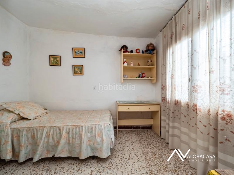 Foto 22b786b0-e190-4e16-8155-3ab03731eeda. Casa  con local en venta en Álora