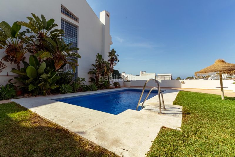 Foto 65d4f181-2ba7-4872-b4a9-124e2f3b2ec5. Casa adossada amb calefacció aparcament piscina a Benalmádena