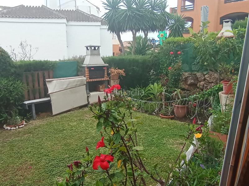 Foto f390cbf0-7b5d-4134-ad71-8da4dd275fbf. Planta baja magnífico piso planta baja con jardín privado, parking asignado y piscina comunitaria en Mijas