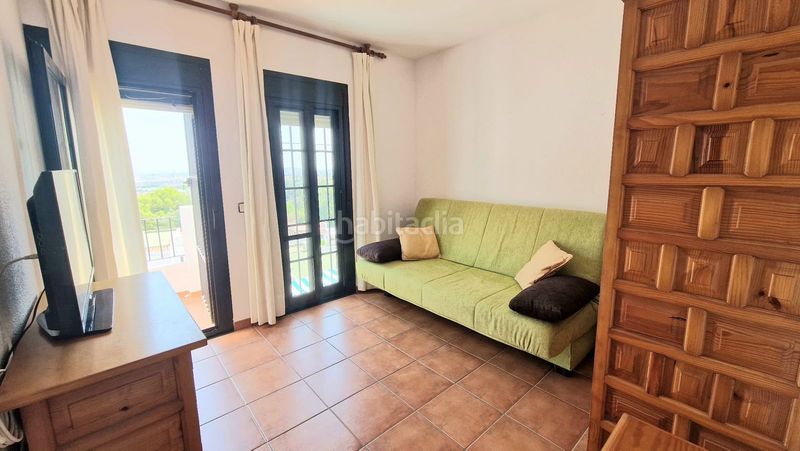 Foto c7ec7f15-ab94-4d68-b8c2-327a5d8c624b. Casa adossada amb xemeneia piscina a campo de Mijas Mijas