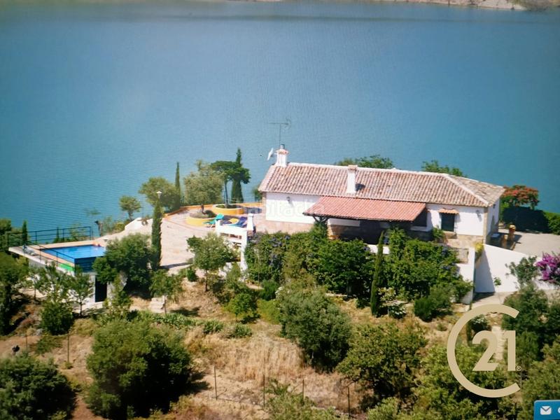 Foto a5356843-3e0e-4c4c-895a-f78c3c6fea63. Chalet en calle veterin 10 finca rústica con piscina y vistas al pantano – lista para entrar a vivir en Gastor (El)