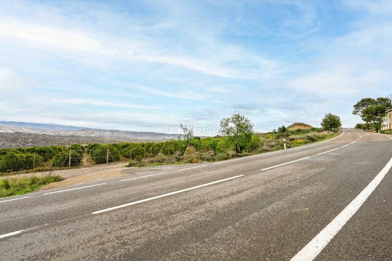 Foto 4f1db8bf-21c5-4259-9c5b-880d754e0814. Finca rústica terreno con vistas en illar en Íllar