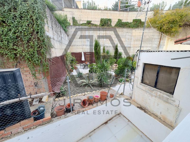 Foto 432f82be-f8dd-43ff-91e8-d06530cef8c4. Casa adossada a Viñuela