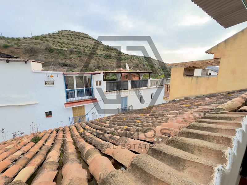 Foto 79df44d9-9795-4371-bd25-7eea002ccfd0. Casa adossada a Viñuela