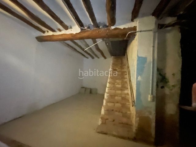 Foto a0a4a9bb-75cf-48e3-bed7-26573fc5f979. Casa adossada amb aparcament a Belchite