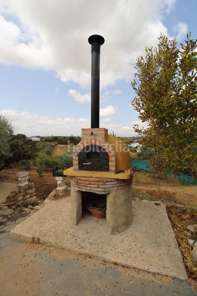 Foto 4c8b518e-39ec-41f7-9272-bc6517f1643b. Masia amb xemeneia calefacció aparcament a Alquería-Torrealquería Alhaurín de la Torre