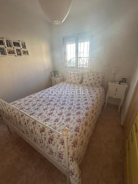 Foto cf1ddd55-2a5f-4e5f-a6df-ab5b399dd759. Piano terra con camino parcheggio in Santa Isabel Málaga
