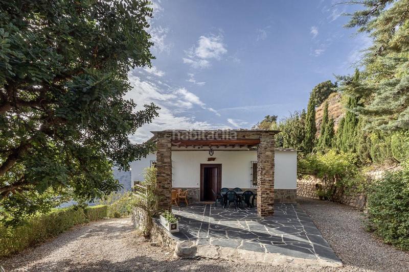 Foto 5c03d8df-1f53-4ad4-834c-1435aadb623c. Masia amb calefacció aparcament a Cáñar