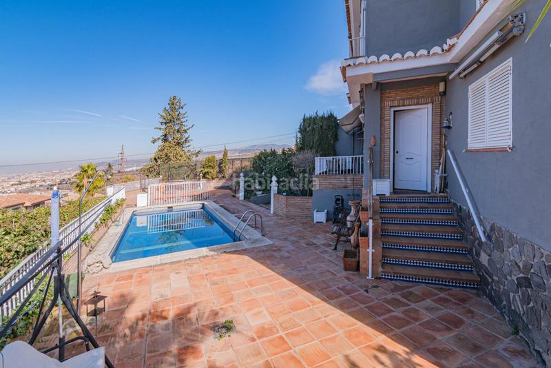 Foto f15c63d9-95ae-4d5d-b088-7f7e9aaf39fd. Chalet avec chauffage parking piscine dans Barrio de la Vega Monachil