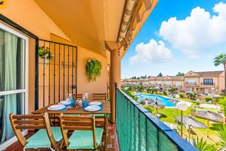 Appartement à La Barrosa. Apartamento en la barrosa en urbanización con piscina y plaza de