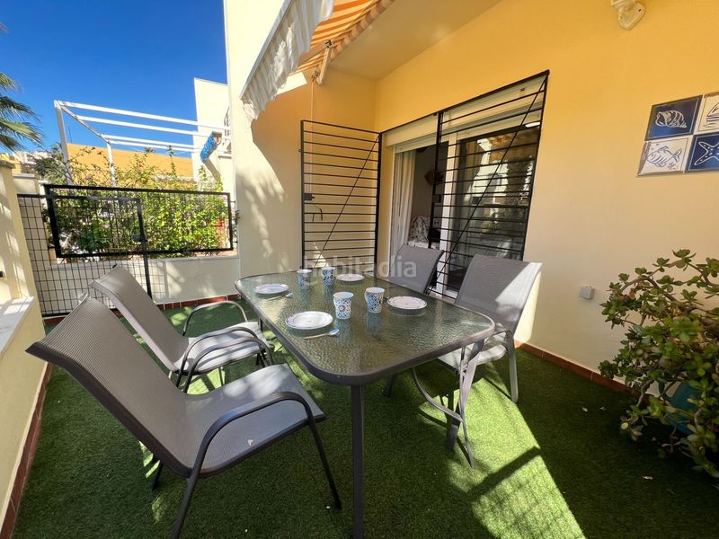 Foto 45a5a672-c68b-48eb-af78-18ce9faad19e. Casa adosada adosado en urbanización privada con terraza y piscina, a 200 metros de playa central en Isla Cristina