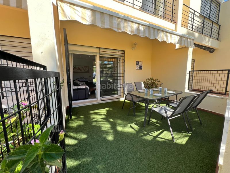 Foto 4d349f29-6972-43b1-a321-c42fb2380f5c. Casa adosada adosado en urbanización privada con terraza y piscina, a 200 metros de playa central en Isla Cristina