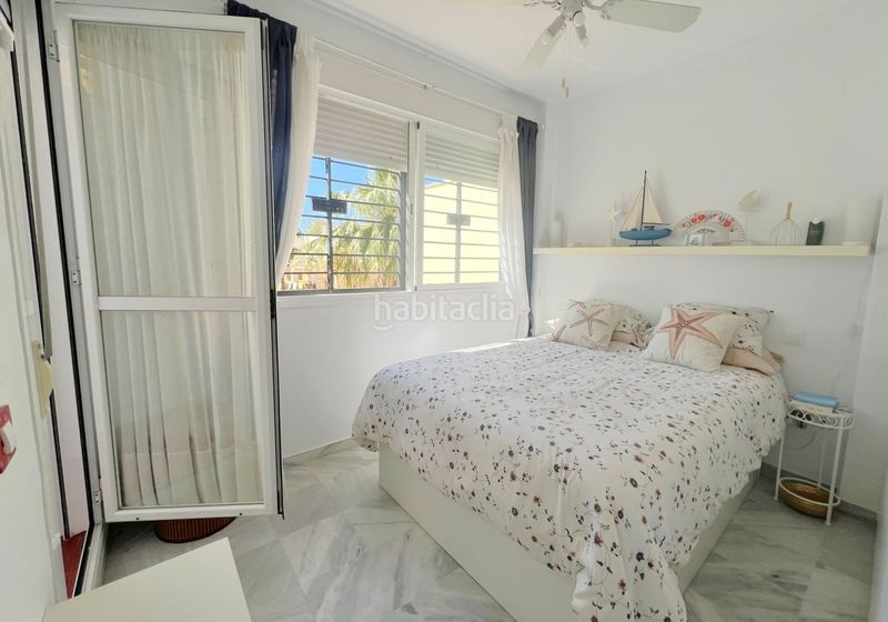 Foto 6f27c4d9-ce4e-457b-bc82-4526ee91f6a5. Casa adosada adosado en urbanización privada con terraza y piscina, a 200 metros de playa central en Isla Cristina